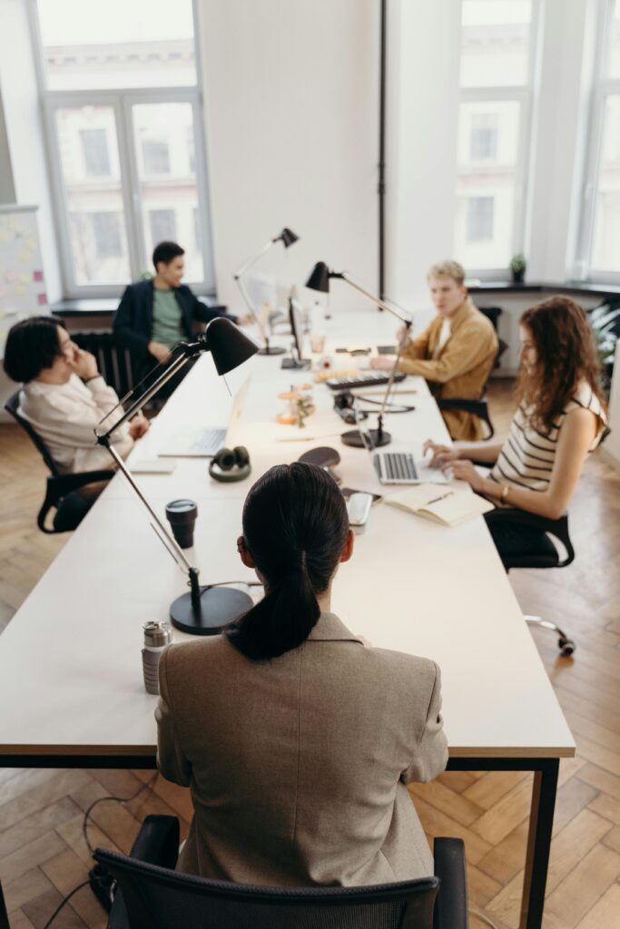 Collaborative business meeting in a modern office with diverse colleagues.